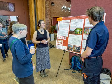 Leah Rice ’28, Jodanna Samburgh ’27, and Lars Fattinger ’28 present their research at the Festival of Scholars.