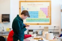 Student working in science classroom
