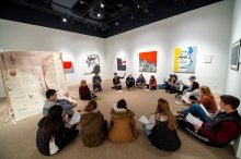 Laurentians sitting in a circle in the art gallery