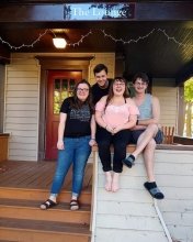 A photo of several Barista members on their house's front porch.