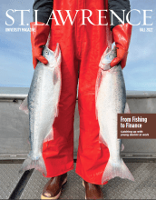 Fall 2022 magazine cover with person on boat holder two salmon