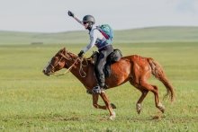 Mary Donohue riding a horse in the 2022 Mongol Derby
